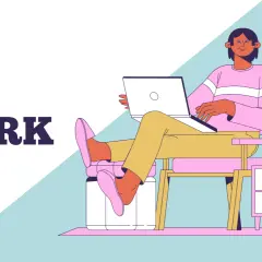 Persona relajada en silla con laptop, explorando la diferencia entre job y work.