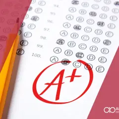 Hoja de examen con lápiz y una A+ marcada en rojo. Ideal para calcular nota B2 Cambridge.