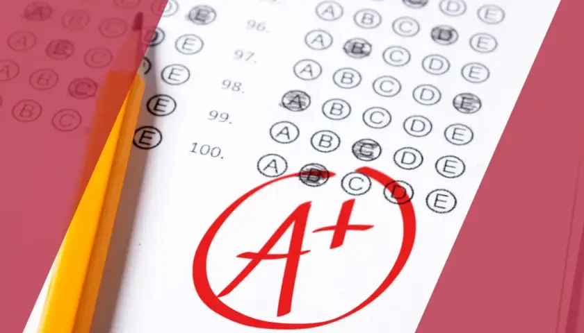 Hoja de examen con lápiz y una A+ marcada en rojo. Ideal para calcular nota B2 Cambridge.